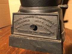 Antique cast iron #19 Buckeye Incubator Co. cast iron coal stove. 22” H x 11.5” W.