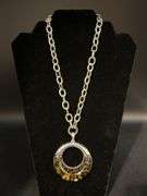 Link chain necklace with round silver tone and acrylic leopard print design pendant