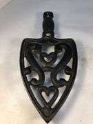 Vintage SAD iron rest/ trivet cast iron, scroll design. Footed.  8 x 3.5”