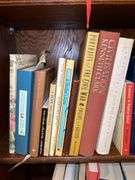 3 shelves of books of various titles and by variety of authors…..both paperback and hardback