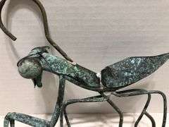 Metal garden grasshopper. Copper with green patina. 8” x 8” overall. Body 6” L