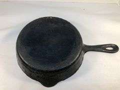 Unmarked 2 spout 8” diameter skillet. No spin, no wobble.