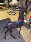Beautiful grouping of Christmas decor…..box of greenery and ribbon, hammered metal deer, (4) great looking ceramic carolers and sleigh with artificial poinsettias