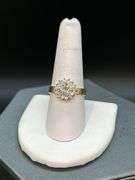14K yellow gold diamond ring with solid center diamond surrounded by 14 smaller diamonds…..total carat weight is approximately 2.75 carats…..NO APPRAISAL OR PAPERWORK IS INCLUDED…..size 8-3/4