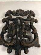Vintage Wilton cast iron Cherub trivet. Black. 8 x 4.5”.