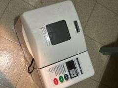 Grouping of small kitchen appliances, electric griddle, fondue set, breadmaker and more