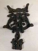 Vintage Wilton cast iron Cherub trivet. Black. 8 x 4.5”.