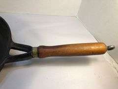 10” diameter 2 spout skillet with wooden handle. Made in Taiwan.