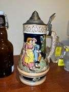 Nice selection of home decor items…..stein on right is musical, football boy is by Danbury Mint, owl pitcher was hand painted in Italy