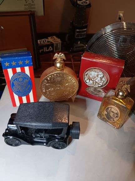 Group of collector avon bottles. See photos image