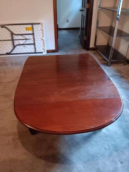 Vintage drop leaf table with 2 leaves. Dimensions 42x72 image