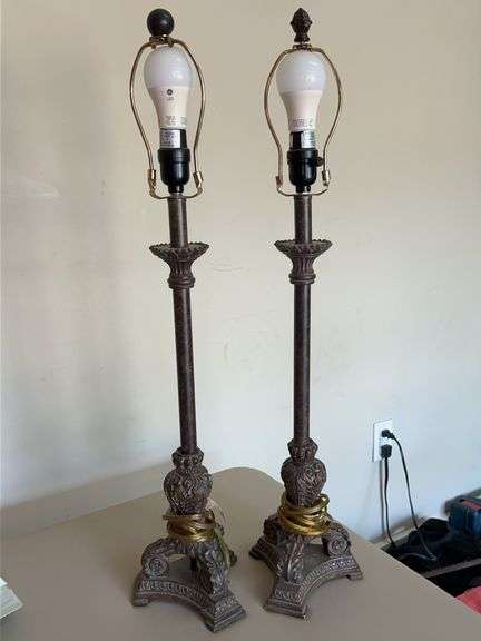Pair of resin base candlestick lamps…..no shades…..30-1/2” tall…..needs a good wipe down from being in attic…..finials do not match image