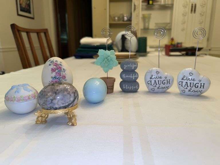 Nice grouping of home decor……from left - porcelain, ceramic and marble eggs, resin name place holders and display mirror image