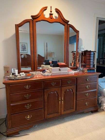 Very nice cherry finish dresser and mirror…..dresser measures 70 x 18 x 32 tall…..folding mirror measures 51-1/4 x 49 tall…..OTHER CONTENTS NOT INCLUDED image