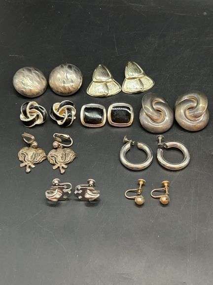 Grouping of silver-tone clip-on and screw back earrings image