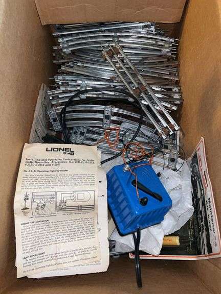 Box of Lionel O Gauge train tracks and other train accessories….. image