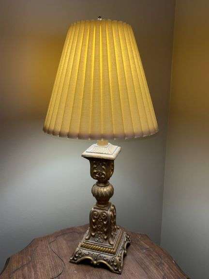 Ornately designed resin base lamp with pleated shade image