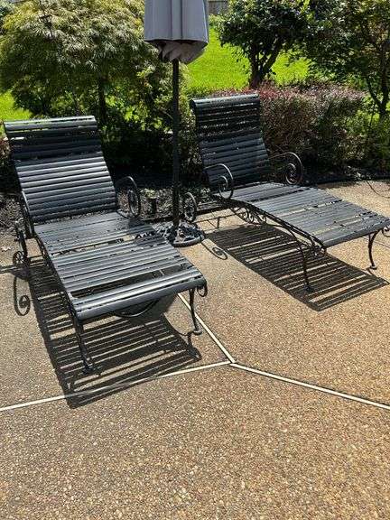Set of (2) strapped wrought iron lounge chairs…..both have straps that need replacing and there is a roll of strapping to be  provided at pickup. image