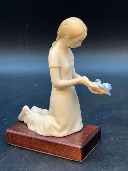 Cybis  "First Flight" bisque porcelain figurine on wood base…..4-1/2” tall image