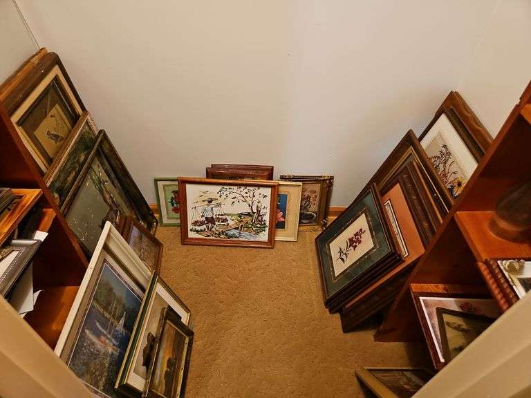 Contents of bedroom closet containing LARGE LOT of framed pictures/decorative art PLUS 25x45 glass top SEE ALL PICS... image