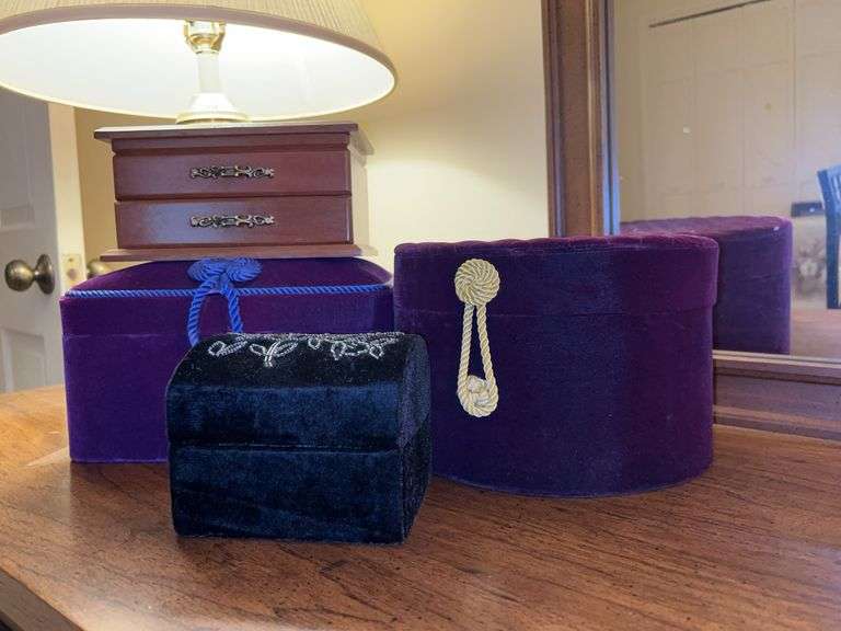 Selection of various size jewelry and accessory boxes…..3 are velvet and 1 is wood…..the 2 velvet purple are vintage  Goldsmith’s…..Mardi Gras beads are included image
