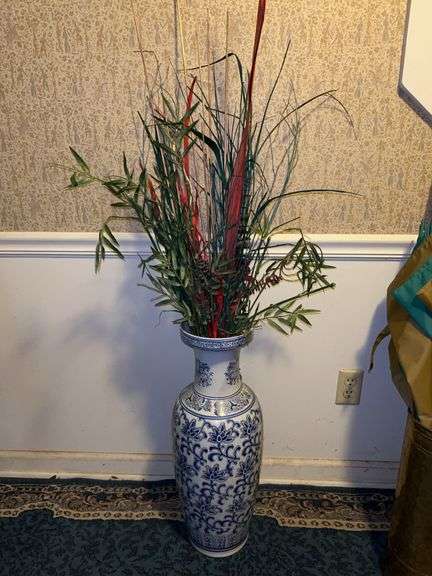 Blue and white floor vase with artificials image