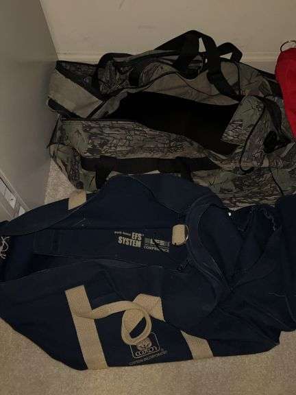 Grouping of various size duffel bags image