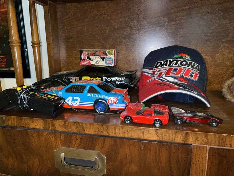 Grouping of NASCAR memorabilia including signed Kevin Harvick hat image