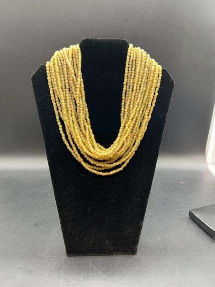 Vintage multi-strand beaded short necklace…..it was hard to capture the true shade of green…..they’re closed to an olive green image