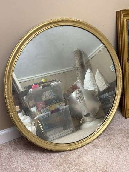 30” round gold-toned framed mirror image