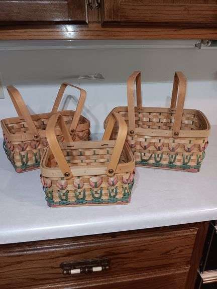 3 very nice baskets in new condition..these are stackable with cute flowers woven into each...3 sizes image