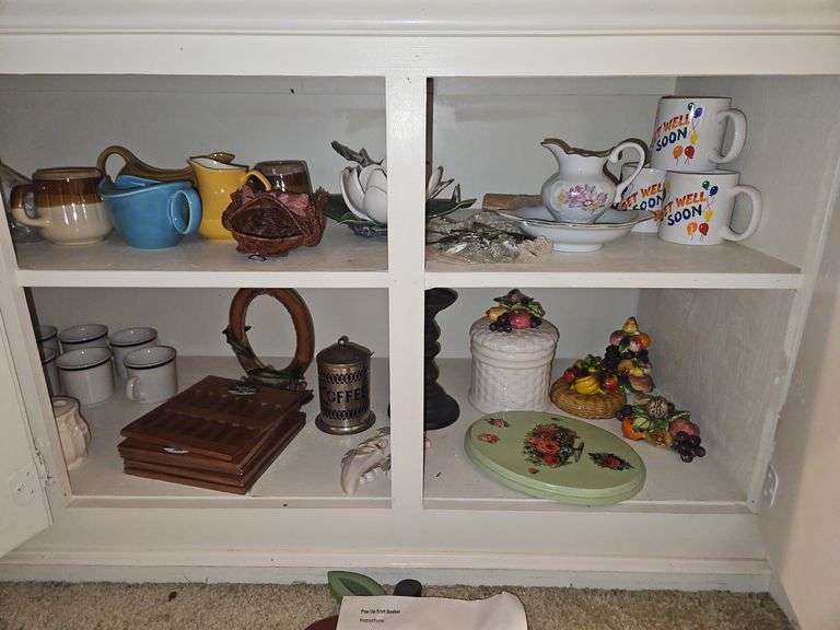 Contents of cabinet under narrow counter in dining room... image