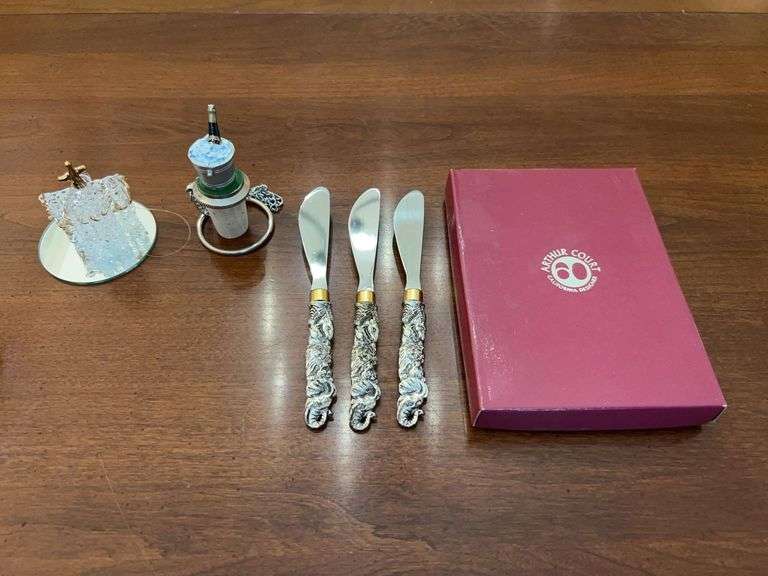 Set of (3) Arthur Court spreaders with African wildlife themed handles in original box, hand blown glass church ornament with attached mirror display and a pewter wine bottle/ice bucket bottle stopper image