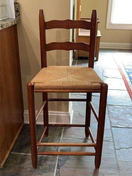 Vintage Oakwood Bar Stool with Rush Seating…..does show wear (possibly from vacuum) but is a sturdy piece…..17-1/2 x 13-3/4 x 24 tall to seat (38” tall overall) image