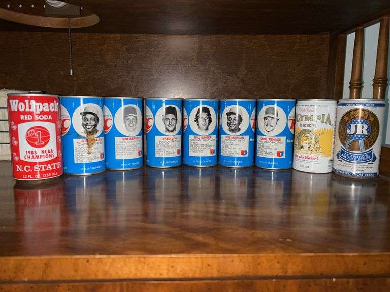Grouping of collectible RC Cola baseball tin cans, NC State Wolfpack tin can, (3) Olympia Beer tin cans and JR Ewing tin can…..all had old school pull tabs image