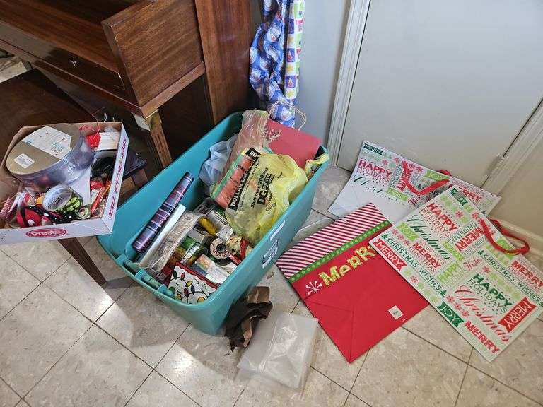 Plastic tub of Christmas wrap, ribbon, & other decor items SEE ALL PICS... image