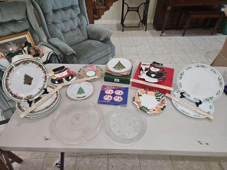 Collection of Christmas-themed plates and serving platters... image