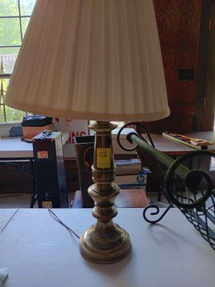 Antique brass lamp and iron magazine holder image