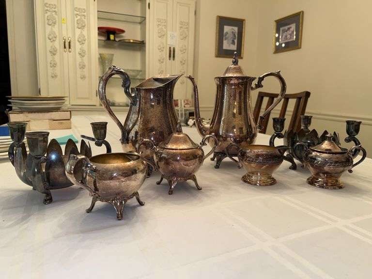 Grouping of silverplate items…..water pitcher is by Roger’s, most others are unmarked, candle holders are by Leonard image