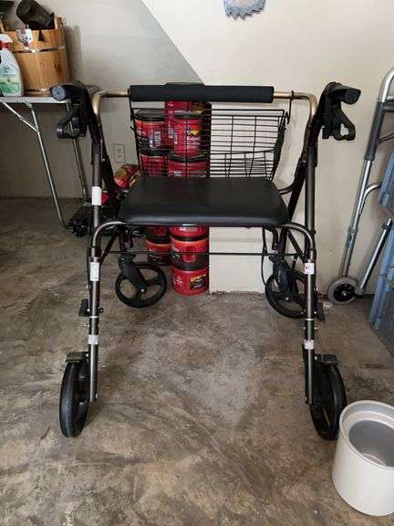 Unmarked Rollator…..brakes work and it is in good condition…..it’s on an uneven surface so it is being blocked by planter image
