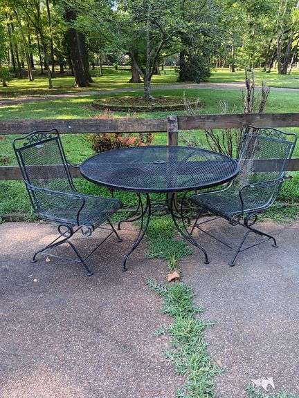 Wrought Iron Patio Table with 2 Chairs included...Chairs do have the spring rocker...Good used condition..needs a good cleaning.. image