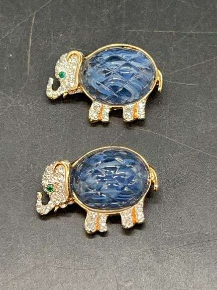 Pair of vintage Carolee elephant brooches with sparkling clear and green stones blue prism center…..1” long image