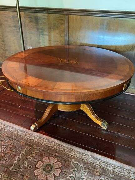 Round Inlaid Mahogany Coffee Table With Duncan Phyfe Style Base with brass overlay on feet…..44”D x 20-1/2” tall…..slight scratching on top image