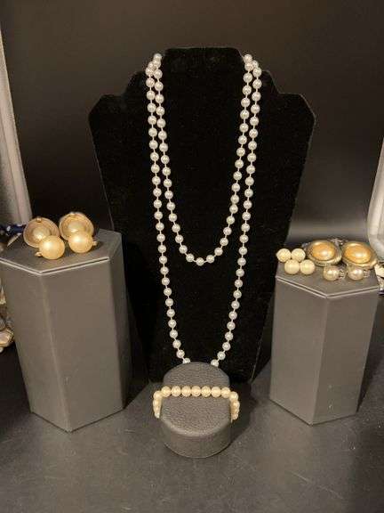 Grouping of pearl-like beaded jewelry…..5 pair of clip-on earrings, stretchy bracelet and long necklace that can be doubled for a layered look image