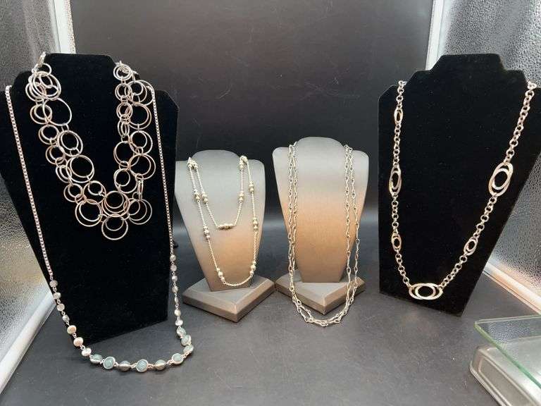 Grouping of longer silver toned necklaces…..doubled for layering and pic purposes image