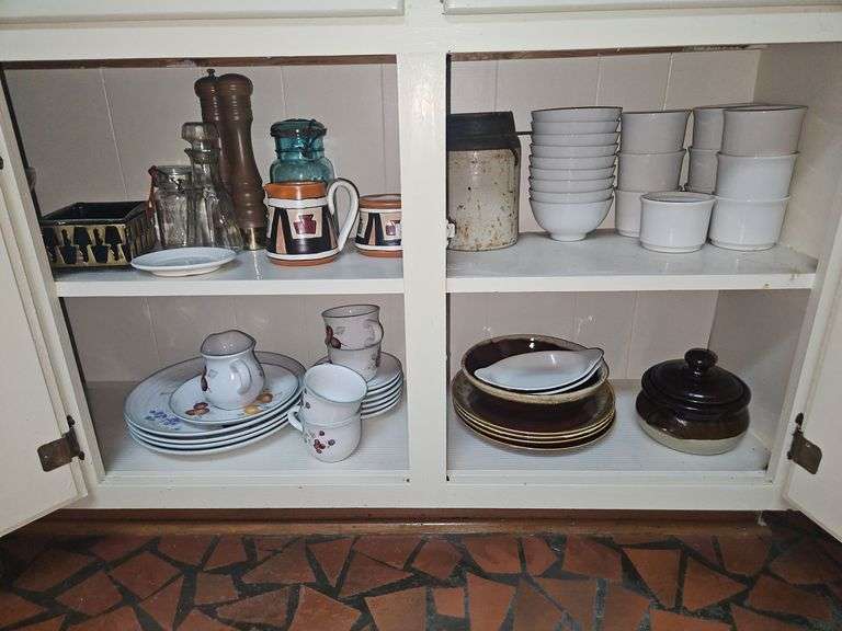 Contents of kitchen cabinet under narrow counter... image
