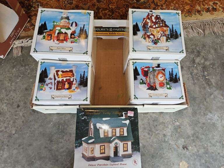 Group of four(4) vintage Santa Town at the North Pole houses & one(1) Heartland Valley Village lighted house... image
