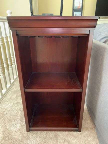 Pottery Barn mahogany finish bookshelf….18 x 14 x 34 tall…..top has sticky residue but it will come off image