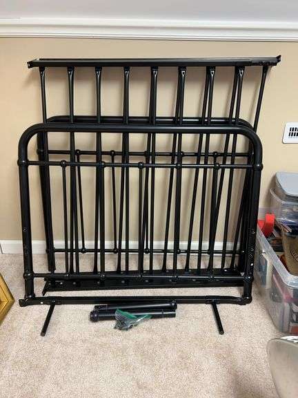 Black metal twin size bed with rails and hardware image
