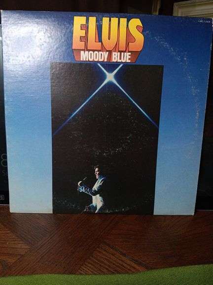 Elvis Moody Blue album. Album is also blue. Excellent condition..shows reflection from light image